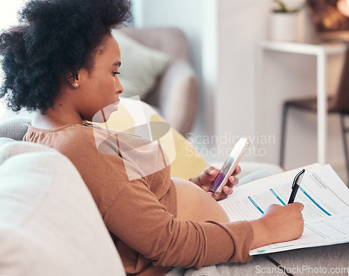 Image of Home, pregnant woman and paper for online application, healthcare, life insurance and smartphone for information. Pregnancy mother on phone and writing on clinic form, documents or paperwork on sofa