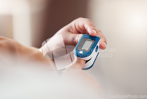 Image of Blood pressure, hand holding technology and background for healthcare check, diabetes or hypertension. Digital device, medical self care and finger or hands with wellness for heart rate check