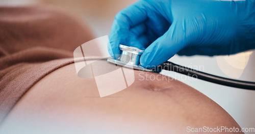 Image of Healthcare, pregnancy and doctor with stethoscope on stomach for health check up of baby in utero. Pregnant black woman, doctors office and medical worker checking heart beat of child at hospital.