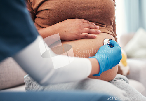Image of Closeup, pregnant and woman with healthcare checkup and stomach with wellness, appointment and results. Zoom, pregnancy and female with doctor, stethoscope and medical professional for consultation