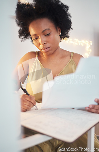 Image of Planning, paperwork and black woman writing a budget, working on tax and home accounting. Finance, loan and African girl with documents for payment, contract and entrepreneurship business investment