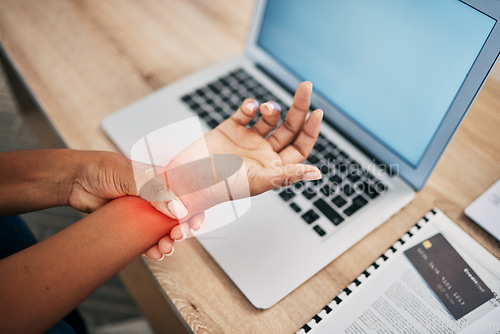 Image of Pain, working and wrist of black woman with laptop and injury, joint inflammation and arthritis from typing. Health, medical care and girl holding hand with muscles strain, stress and carpal tunnel