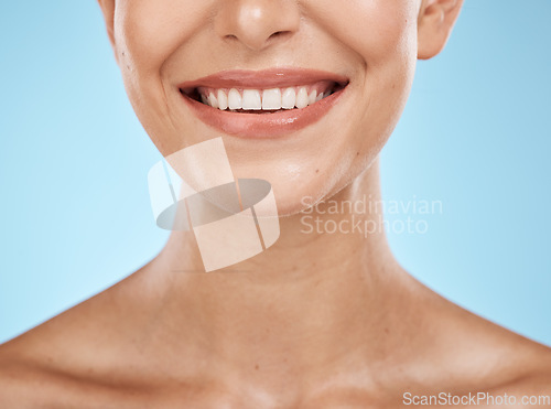 Image of Closeup, mouth and woman with skincare, cosmetics and dermatology with girl on blue studio background. Face, female and lady with clean teeth, natural beauty and grooming routine for fresh breath