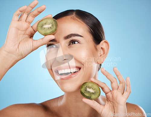 Image of Kiwi, skincare and woman isolated on studio background for natural beauty, cosmetics and facial product on mockup. Healthy, organic and happy model or person fruits for face, dermatology or vitamin c