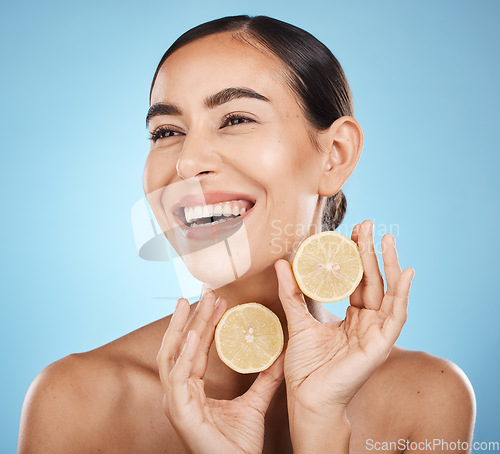 Image of Skin care, lemon and woman happy about beauty cosmetics, dermatology and wellness. Aesthetic model for natural vitamin c facial glow, nutrition diet and healthy smile or face detox on blue background