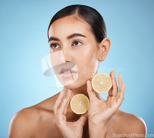 Image of Lemon skin care, beauty and woman with vitamin c for dermatology, natural cosmetics and wellness. Aesthetic model person for sustainable facial glow, nutrition and detox for face on blue background