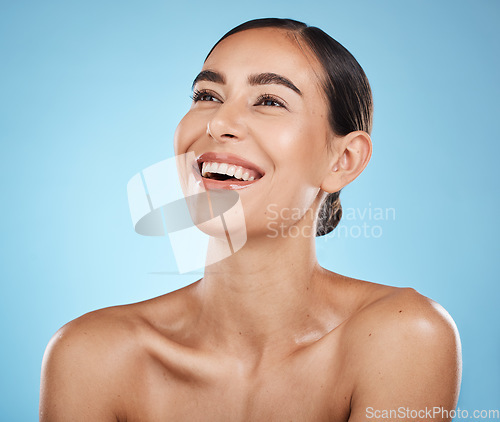 Image of Face, thinking and beauty skincare of woman in studio isolated on a blue background. Aesthetics, makeup and cosmetics of female model with healthy, glowing or flawless skin after spa facial treatment
