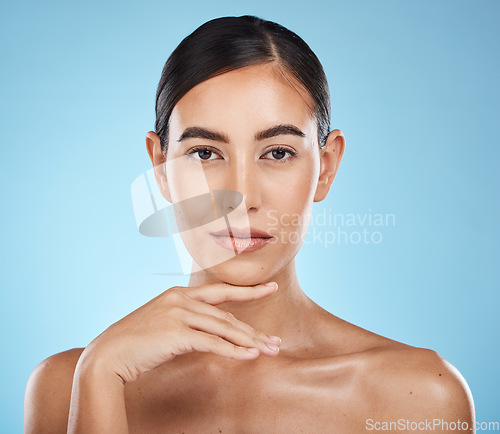 Image of Face, portrait and beauty skincare of woman in studio isolated on a blue background. Aesthetics, makeup and cosmetics of female model with healthy, glowing or flawless skin after spa facial treatment