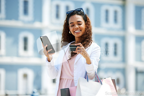 Image of Shopping, phone and credit card of woman for ecommerce or travel payment for a sale or discount. Person with smile for designer fashion, retail promotion and paper bag for online fintech banking app