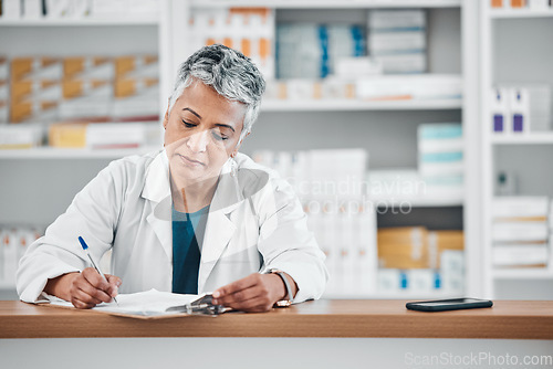 Image of Senior woman, pharmacist writing and paper data of pharmacy stock or insurance documents. Healthcare, doctor and elderly female wellness consultant with store logistics research about shop products