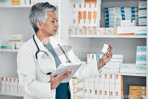 Image of Medication, tablet and female pharmacist in pharmacy doing research on pills and medicine. Healthcare, medical and senior pharmaceutical worker checking prescription chemist drugs at medicare clinic.