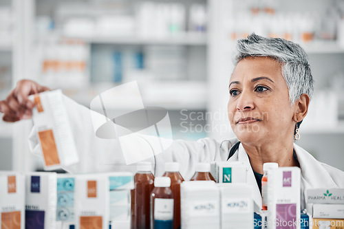 Image of Pharmacy shelf, medicine and senior woman with pills, supplements and medication for prescription in clinic. Wellness, pharmaceutical store and pharmacist check drugs, vitamins and medical products