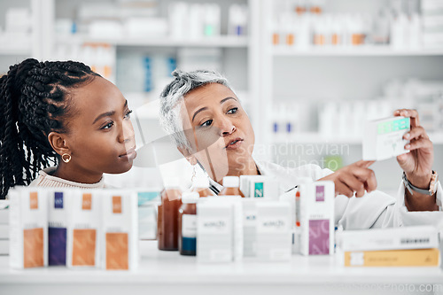 Image of Pharmacy, help and customer with medicine information at drugstore, advice and label check by friendly worker. Senior lady, pharmacist and black woman consulting for pills, treatment and questions