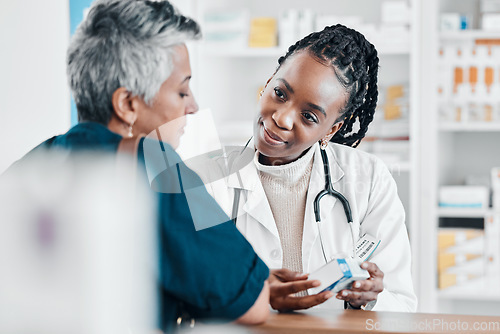 Image of Pills, pharmacy or old woman consulting with a pharmacist for retail healthcare treatment information. Questions, trust or black woman helping a senior woman shopping for medicine or medical drugs