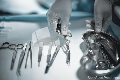 Image of Operation, doctor and medical instruments for surgery in a ER or operating room in the hospital. Emergency, steel appliances and nurse prepare tools for a surgeon for healthcare in surgical theatre.