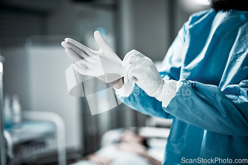 Image of Hands, latex gloves and surgeon preparing for operation in a consultation room in the hospital. Healthcare, surgical and medical doctor ready for surgery in ER or emergency theatre in medicare clinic