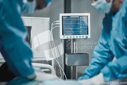 Image of Monitor, electrocardiogram and doctors in surgery, healthcare and operating for emergency, procedure or teamwork. Medical professionals, team or staff with screen, support or saving a life in theater