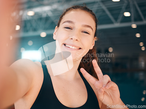 Image of Peace sign, selfie and portrait of a woman athlete after a swimming exercise, training or competition. Fitness, sports and happy female swimmer taking a picture with a hand gesture after a workout.