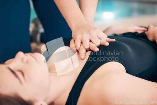 Image of Healthcare, lifeguard and chest compression, first aid for drowning victim at pool with emergency training for safety. Swimming, teaching and learning cpr, life saving help at water for staying alive