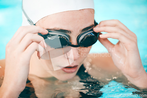 Image of Swimmer, hands and face with goggles in fitness sports for exercise, workout or training in swimming pool. Sporty athletic woman professional in practice for underwater swim competition in swimwear