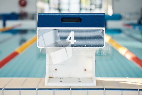 Image of Sports, swimming and podium number by pool for training, exercise and workout for triathlon competition. Fitness, motivation and four on professional diving board ready for dive, start and race