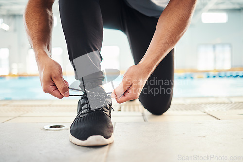 Image of Lace shoes, swimming coach and man on ground for workout, training and wellness. Closeup guy tie sneakers for pool exercise, sports and water performance for healthy body, fitness goals and footwear