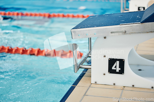 Image of Sports, swimming pool and number on diving board for training, exercise and workout for triathlon competition. Fitness, motivation and four on professional podium for dive, marathon start and race