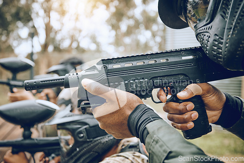 Image of Paintball, gun and target with team, action and sports outdoor, people on battlefield and soldier focus during war game. Extreme sport, aim and military mission, exercise and fitness with motion blur