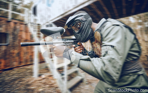 Image of Paintball, black man and games, gun and target, sport with fitness and battlefield challenge, war soldier outdoor. Motion blur, extreme sports and exercise, shooting range and military mission