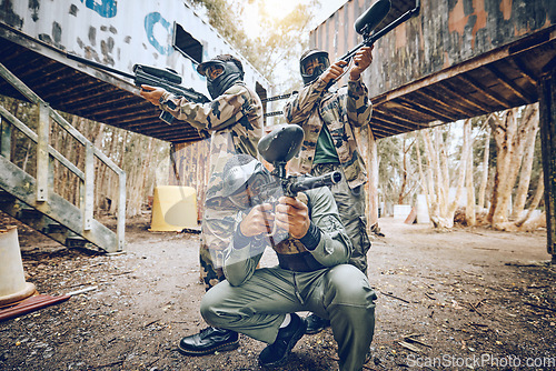 Image of Paintball teamwork, shooting together and war game with vision, mask or tactical strategy for safety in competition. Military training, team building or group for weapon, formation or friends outdoor