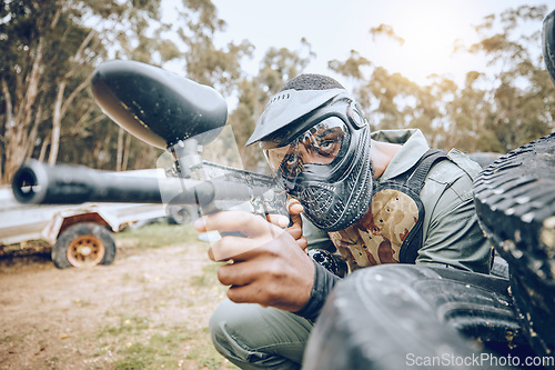 Image of Paintball, man and gaming, gun and target with sport, fitness on battlefield and challenge with war soldier outdoor. Extreme sports, aim weapon and shooting range with military mission and training