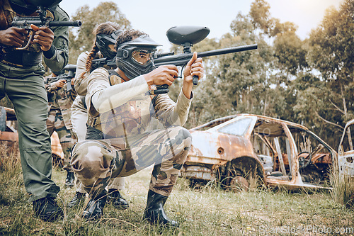 Image of Target, teamwork and paintball with people in field for sports, fitness and shooting games. War, smoke and community with man gamer playing in camouflage for military, army and competition training