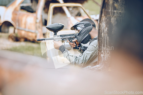 Image of Action, paintball and target with man in field for sports, fitness and shooting games. War, soldier and adventure with gamer playing in camouflage for military, army and competition training