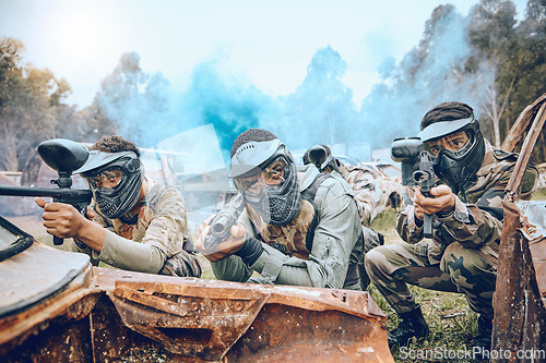 Image of Paintball gamer, team shooting and soldier group for military, army and field game training. Exercise, fitness and target goal of a men on battlefield together in a sports event outdoor with focus