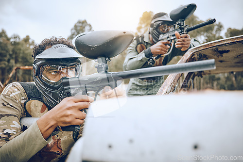 Image of Paintball gun, man and group with aim, shooting strategy and team formation in military combat game. Army training, warfare games and adventure on battlefield, outdoor challenge and teamwork friends