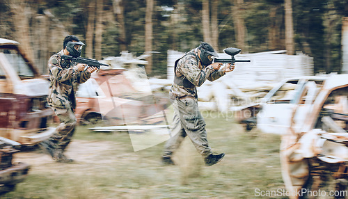 Image of Paintball, team running and soldier group energy for military, army and field game training. Exercise, fitness and target shooting of a battlefield players in a sports event outdoor with focus