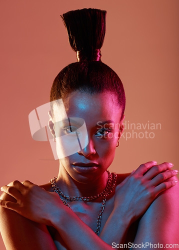 Image of Portrait, serious and fashion with a model black woman in studio on a neon background for beauty. Art, makeup and style with an attractive young female posing indoor for culture or cosmetics