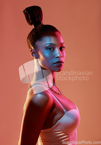 Image of Portrait, fashion and hair with a model black woman in studio on a neon background for beauty. Art, hairstyle and style with an attractive young female posing indoor for culture or cosmetics