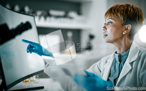 Image of Doctor, research or black woman on computer for analytics in science lab for DNA research, medical or medicine data analysis. Scientist, healthcare or nurse on health, innovation or covid virus study