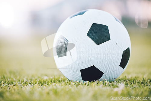 Image of Soccer, ball and field for sports game time or match start in athletics or football tournament in the outdoors. Round sphere object with pentagon shape spots on green grass for sport on mockup