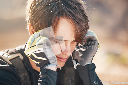 Image of Headache, thinking and man in nature for cycling, motorcycle stress and sad about fail. Depression, mental health and biker with a migraine after training for sports with competition fear in France