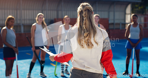 Image of Instructions, sports and hockey team with coach for planning, game strategy and goals for female players on court. Fitness, training and woman coaching girls for match, practice and competition