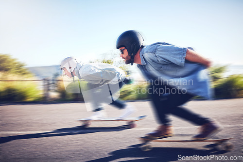 Image of Sports, speed and blur, longboard race in road with men racing downhill on skateboard with helmet safety. Extreme sport adventure, friends skateboarding in street and skateboarder on mountain pass.