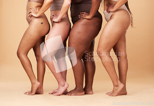 Image of Diversity women, legs and different body and skin of group together for inclusion, beauty and power. Underwear model people on beige background with cellulite, pride and motivation for self love