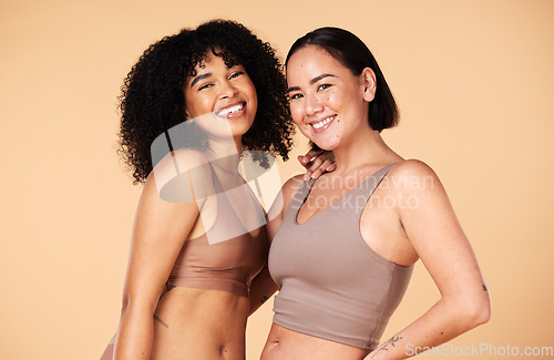 Image of Diversity, friends and beauty of women in underwear in studio isolated on a brown background. Portrait, lingerie and body positive happy girls with makeup, cosmetics and healthy skincare for wellness