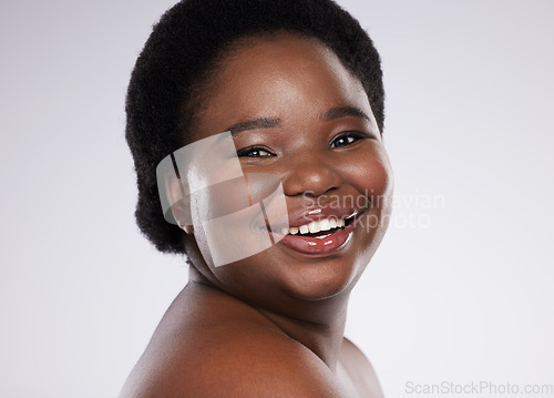 Image of Black woman, portrait smile and skincare beauty with teeth, cosmetics or makeup against a gray studio background. Happy African American female smiling in satisfaction for self love, care or facial