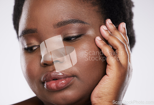 Image of skincare, beauty and black woman with hands and face zoom for spa and makeup aesthetic. White background, isolated and studio model with skin glow from dermatology and facial wellness results