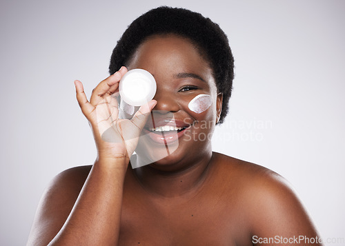 Image of Portrait, black woman and cream for skincare, dermatology and cosmetics with girl on grey studio background. Face lotion, African American female and lady with beauty, creme and wellness on backdrop