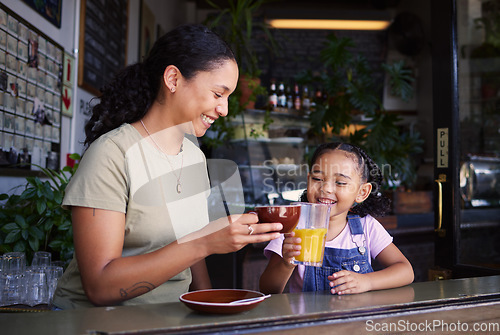 Image of Coffee shop, black family and toast with a mother and daughter enjoying a beverage in a cafe together. Juice, caffeine and cheers with a woman and happy female child bonding in a restaurant