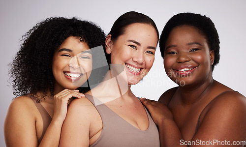 Image of Portrait, diversity and women with skincare, smile and bonding together on grey studio background. Face, multiracial and females with cosmetics, support or solidarity with body positivity on backdrop